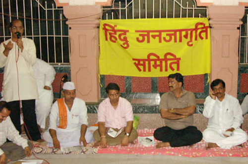 From Left Shri. Ravindran, H.B.P. Ganesh Maharaj,</br>Shri. Shinde & Shri. Vivek Patil” title=”From Left Shri. Ravindran, H.B.P. Ganesh Maharaj,</br>Shri. Shinde & Shri. Vivek Patil” /><br />
<br />From Left Shri. Ravindran, H.B.P. Ganesh Maharaj,</br>Shri. Shinde & Shri. Vivek Patil
</div>
<p>Panvel:</strong> A meeting was held of various organizations, sampradayas, parties and trustees at Sree Virupaksha temple to decide upon further plans to expand the agitation against Government’s proposed ‘Temple take-over’ Act. Shri. Vivek Patil, MLA of Peasants and Workers’ Party (PWP) warned that such move of the Government will lead to outburst of Hindu feelings. Every office bearer of the participating organization declared that they would bring maximum number of respective members for the public meeting. It was also decided to inform as many Hindus as possible about the forthcoming meeting. </p>
<p>Shri. Balasaheb Patil and Shri Bhaskar Chavan, the district and city chiefs respectively of BJP announced that a meeting of all municipal councilors of BJP-Shiv Sena will be held in this context. Leaders of many organizations and trusts like RSS, Asaram Bapu Sampradaya, Sree Hanuman temple, Sree Ayappa temple, Panvel Gurudwara, Konkan Dindi, Balaji Devsthan, H. H. Kalavati Aai Sampradaya, Maharashtra Prabodhan Warakari Mandal etc. attended the meeting. Through the medium of discourses and keertans, the issue will be taken to people. </p>
<p><strong>Source:</strong> <a href=